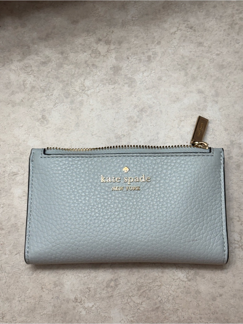 kate spade light blue pebbled leather zip wallet with silver logo